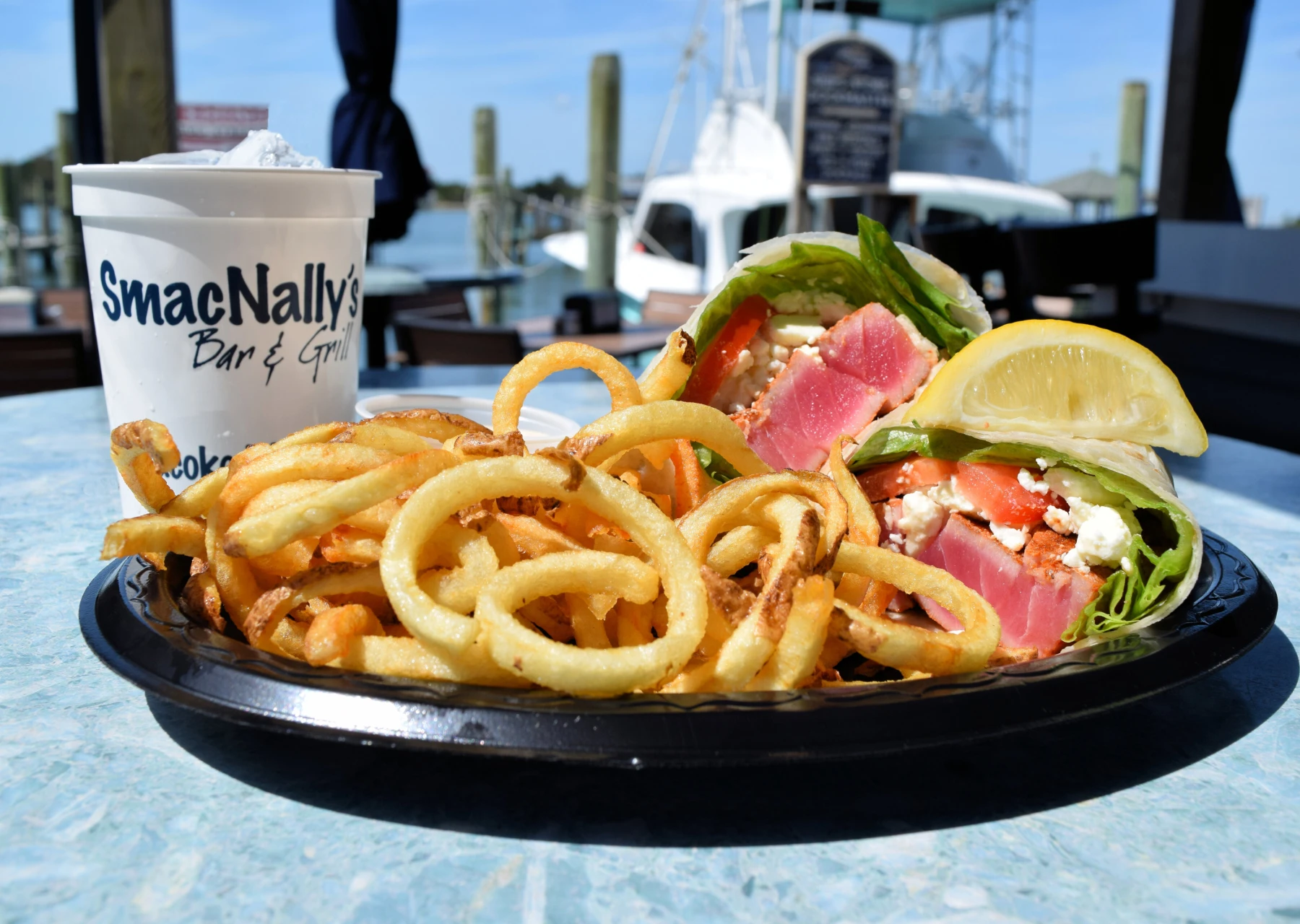 Ahi Tuna Sandwich Wrap with Curly Fries at SmacNallys Waterfront Bar and Grill - Hero